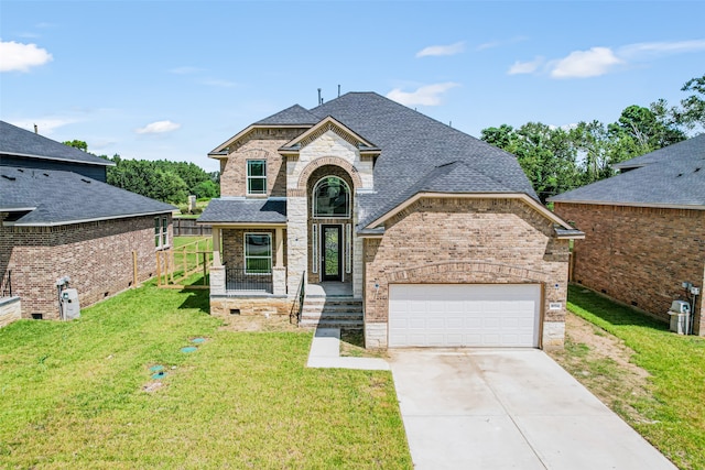 view of front facade with a garage and a front yard