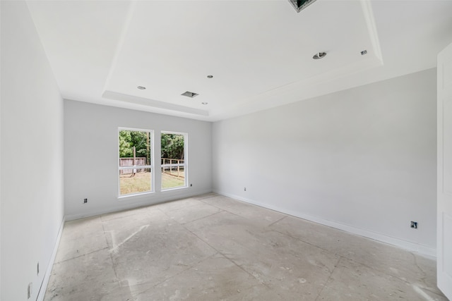 empty room with a tray ceiling