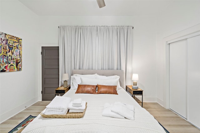 506 E Evergreen St, San Antonio, TX 78212 - bedroom with light wood-style floors, a closet, and a ceiling fan