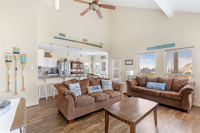 living room with ceiling fan, beam ceiling, high vaulted ceiling, and dark hardwood / wood-style floors