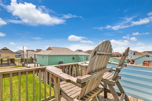 wooden deck with a lawn