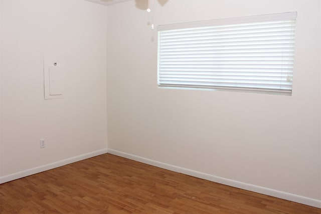 empty room with wood-type flooring