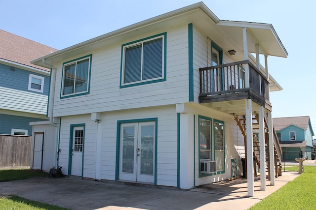 rear view of property with a balcony