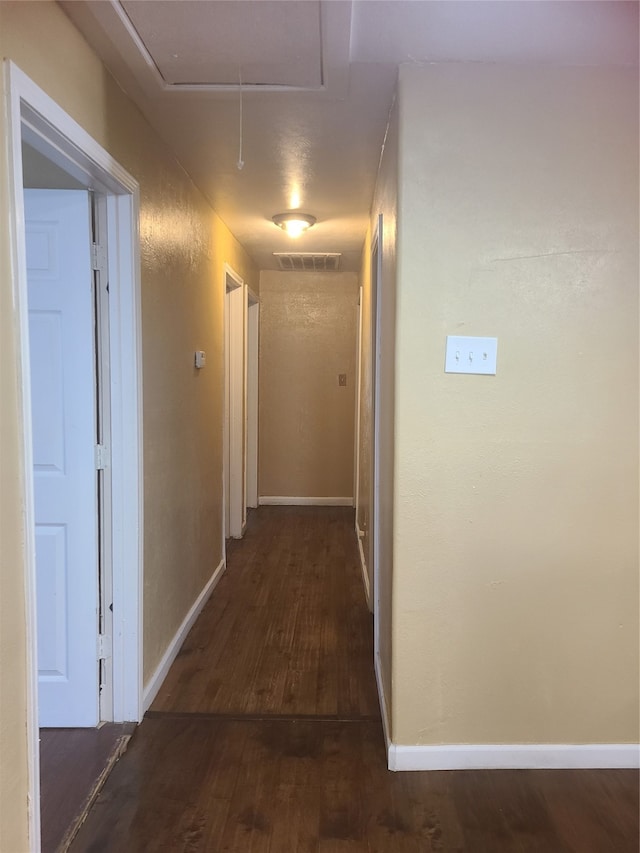 hall featuring dark wood-type flooring