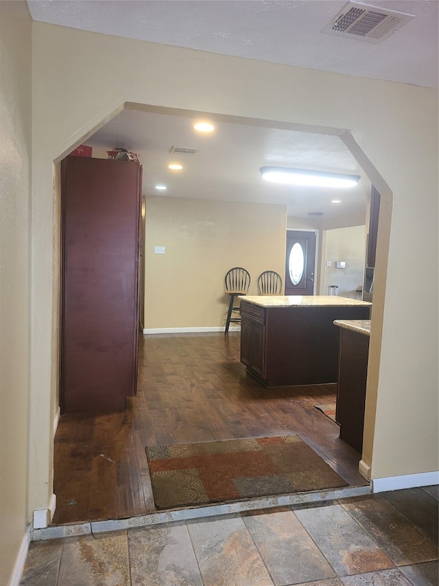 kitchen with dark wood-type flooring