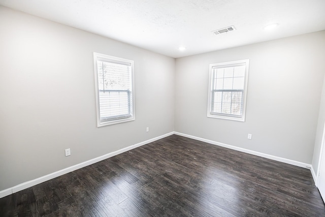 empty room featuring hardwood / wood-style flooring