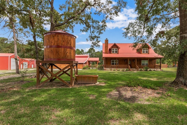 view of yard featuring covered porch