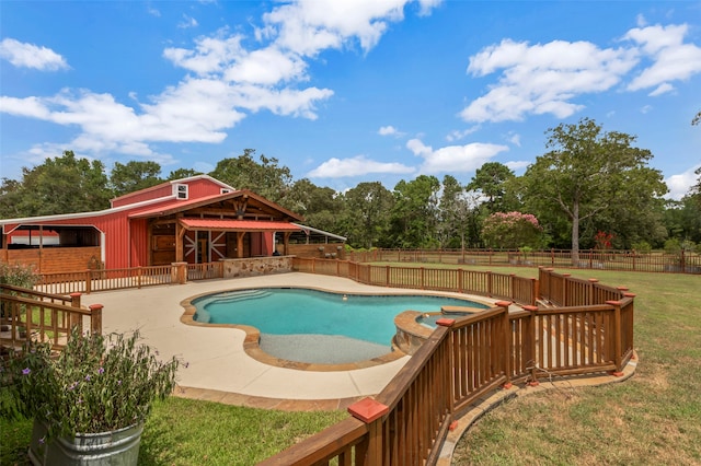 view of pool featuring a lawn