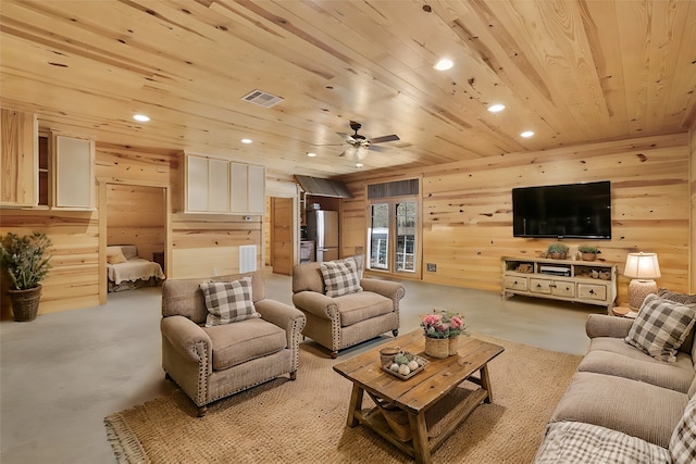 living room featuring wooden ceiling, ceiling fan, and wood walls