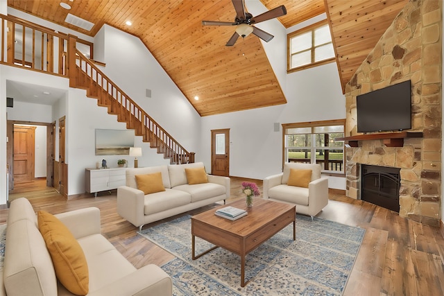 living room featuring wooden ceiling and a high ceiling