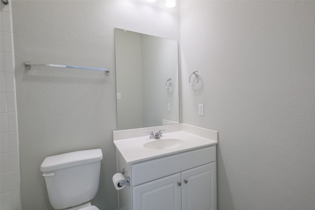 bathroom with toilet and vanity