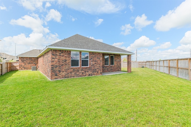 back of property with a patio and a lawn