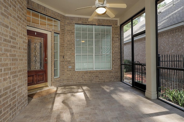 doorway to property featuring ceiling fan