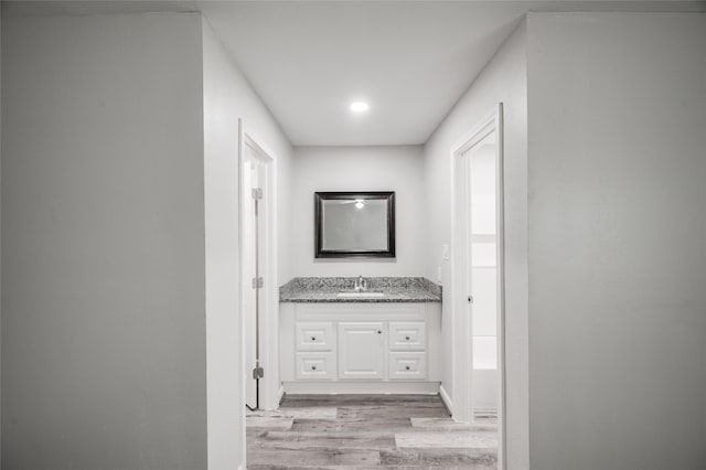 bathroom featuring vanity and wood finished floors