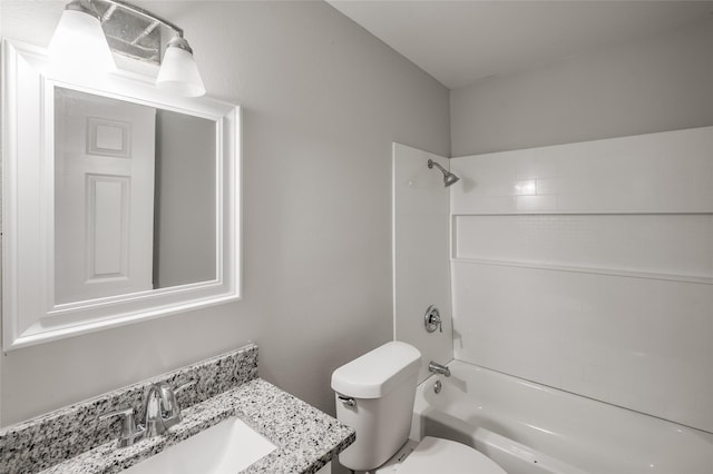 full bathroom featuring bathtub / shower combination, vanity, and toilet