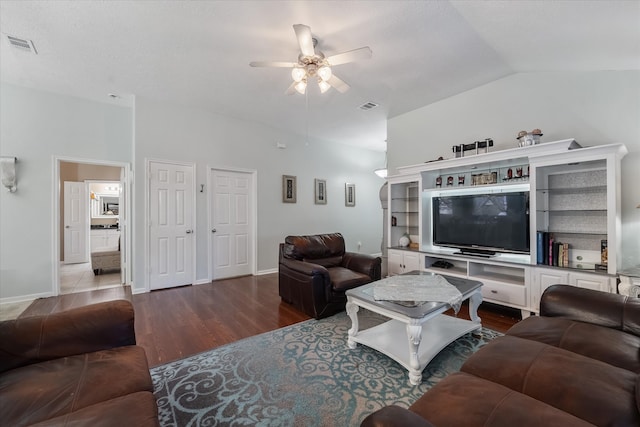 living room with ceiling fan, vaulted ceiling, and tile patterned flooring