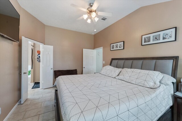 tiled bedroom featuring ceiling fan and lofted ceiling