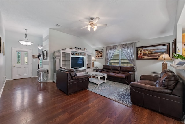 living room featuring ceiling fan, dark wood-type flooring, a healthy amount of sunlight, and vaulted ceiling