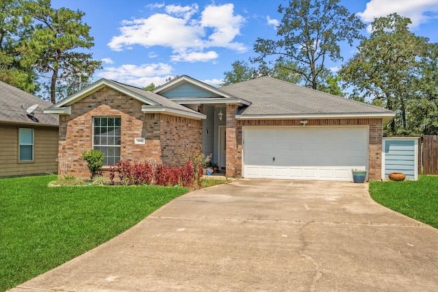 ranch-style house featuring a front yard and a garage