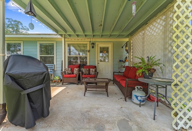 view of patio with area for grilling and outdoor lounge area