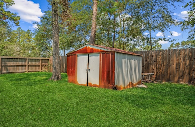 view of outbuilding featuring a yard