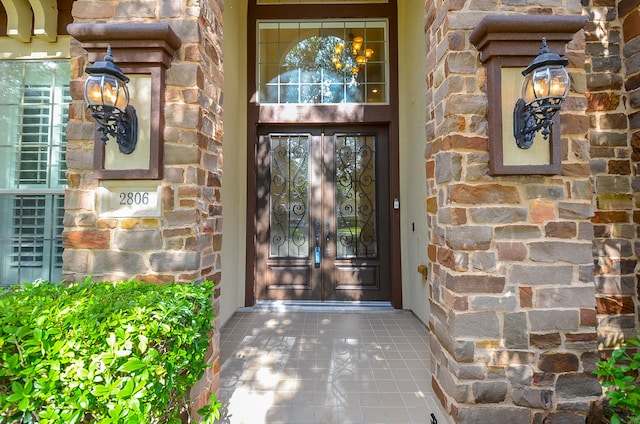 property entrance featuring french doors