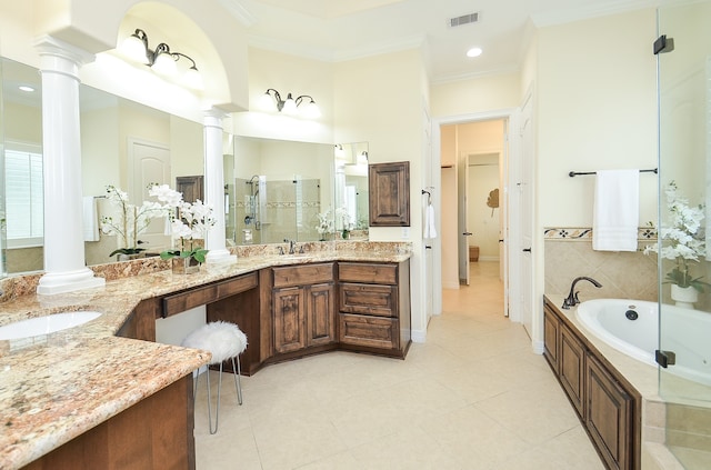 bathroom featuring tile patterned floors, ornamental molding, and ornate columns