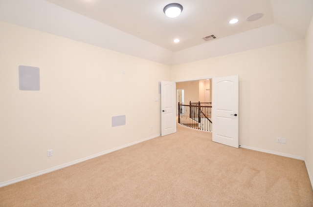 unfurnished bedroom with light colored carpet