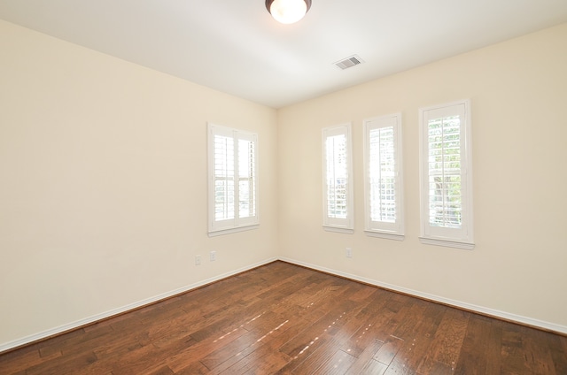 empty room featuring dark hardwood / wood-style floors