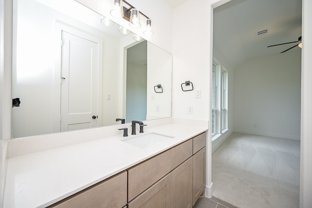 bathroom with ceiling fan and vanity