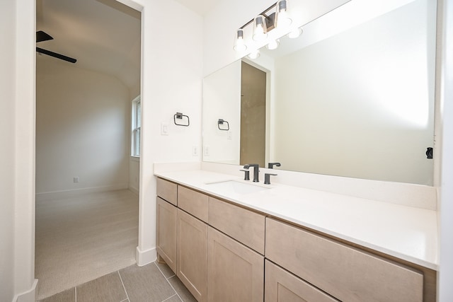 bathroom with tile patterned floors, ceiling fan, and vanity