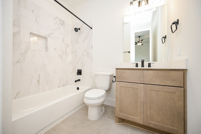 full bathroom featuring ceiling fan, tiled shower / bath combo, tile patterned flooring, toilet, and vanity