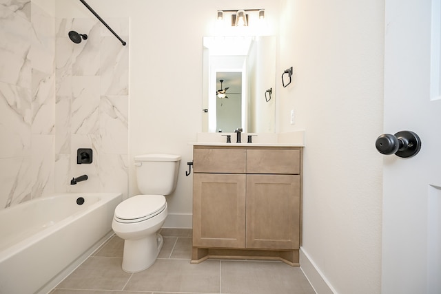 full bathroom featuring vanity, tile patterned floors, tiled shower / bath combo, ceiling fan, and toilet