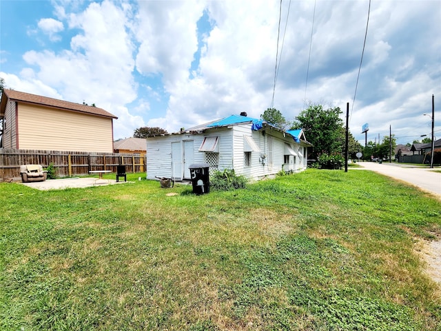 view of home's exterior with a yard