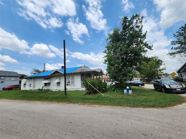 view of home's exterior with a lawn