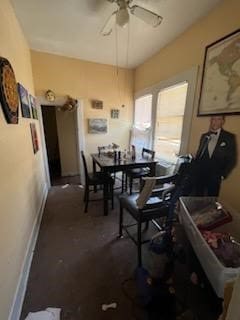 301 Vincent St, Houston, TX 77009 - dining space with a ceiling fan, dark colored carpet, and baseboards