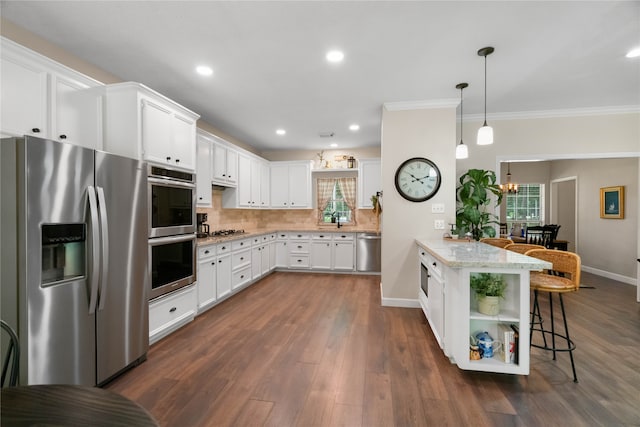 kitchen featuring dark hardwood / wood-style flooring, decorative backsplash, a kitchen bar, and appliances with stainless steel finishes