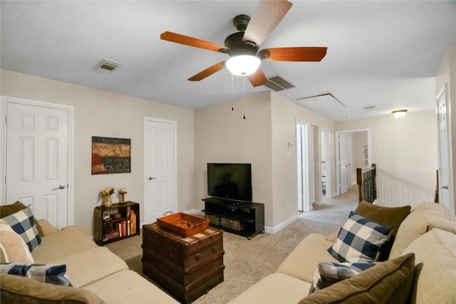 carpeted living room featuring ceiling fan