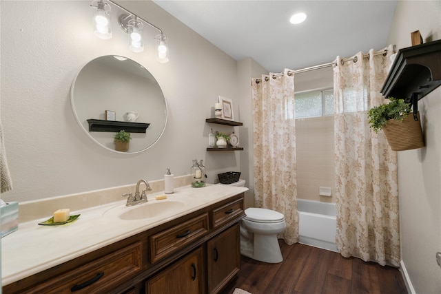 full bathroom featuring shower / bath combination with curtain, toilet, hardwood / wood-style flooring, and vanity