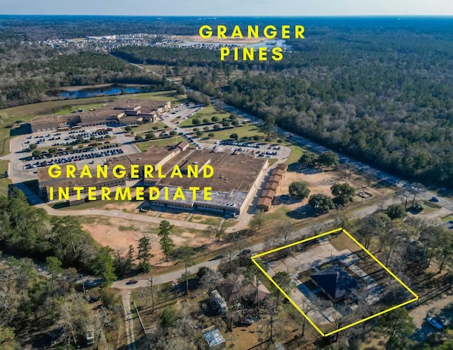 drone / aerial view with a view of trees