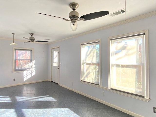 empty room with ceiling fan, crown molding, tile patterned flooring, and a healthy amount of sunlight