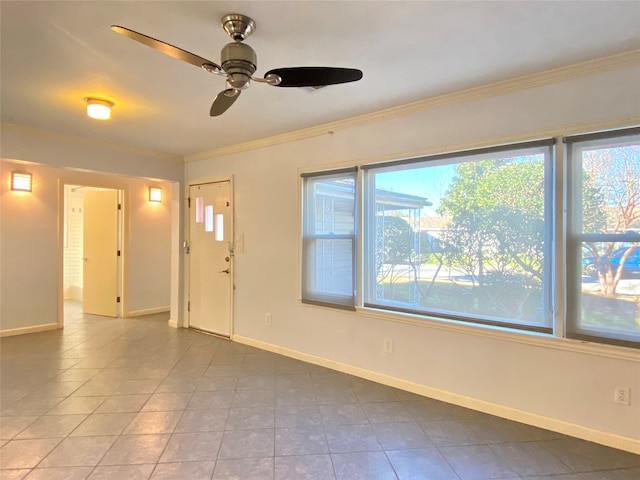 foyer featuring ceiling fan, ornamental molding, and tile patterned flooring