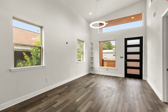 entryway featuring dark hardwood / wood-style floors and high vaulted ceiling