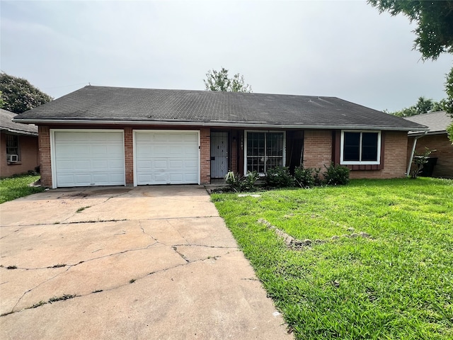 single story home featuring a garage and a front yard