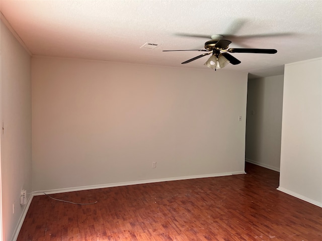 spare room with hardwood / wood-style flooring, a textured ceiling, and ceiling fan