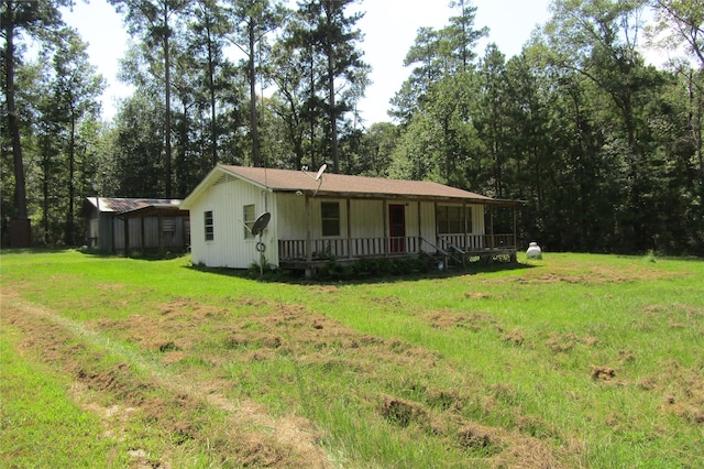 view of front of house with a front lawn and a porch