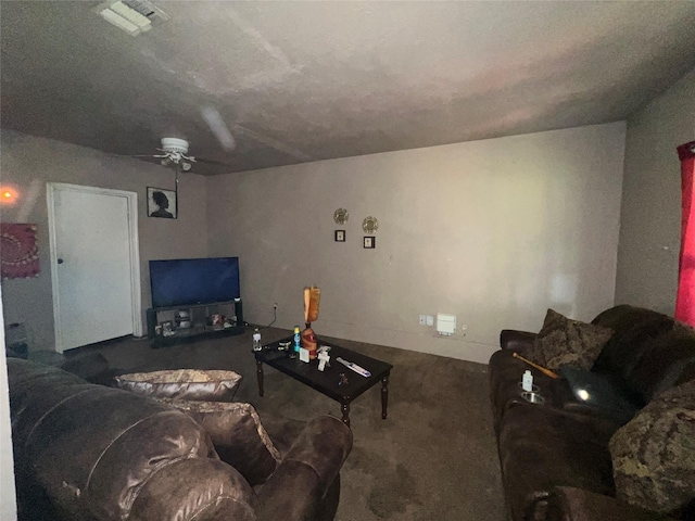 carpeted living room featuring a ceiling fan and visible vents