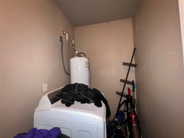 clothes washing area featuring water heater