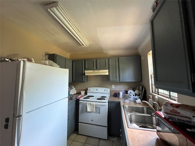 kitchen with sink, white appliances, and light tile patterned floors