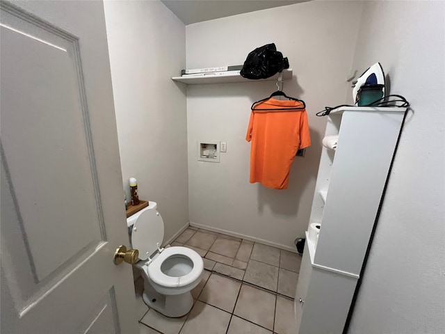 bathroom featuring toilet and tile patterned floors